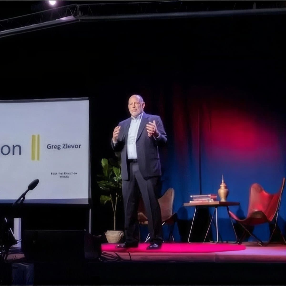 Greg Zlevor speaking on stage